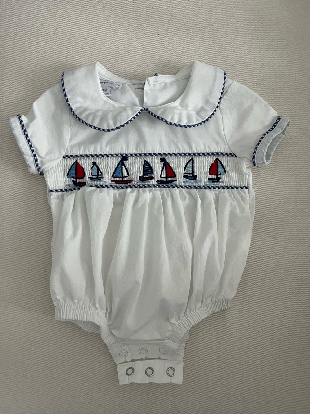 Mud Pie White Baby Romper with Navy Trim and Sailboat Smocking